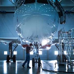 Aerospace engineer working on airplane