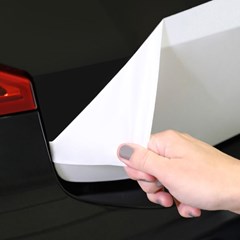 Surface Protection film is being peeled off automotive exterior part.